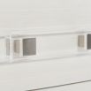 A sophisticated bedside table by Bernhardt featuring a grey and white finish and completed with three spacious drawers