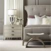 A chic minimal natural wood bedside table with tarnished nickel accents