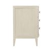 A chic minimal natural wood bedside table with tarnished nickel accents