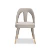 A luxury dining chair by Liang & Eimil with a gorgeous grey upholstery and brass detailing