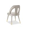 A luxury dining chair by Liang & Eimil with a gorgeous grey upholstery and brass detailing