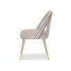 A luxury dining chair by Liang & Eimil with a gorgeous grey upholstery and brass detailing