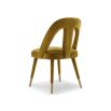 Upholstered mustard chair with lavish velvet and tapered legs
