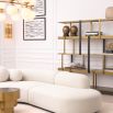 An exquisite, contemporary curved sofa with boucle upholstery