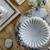 White marble bowl in carved curve design