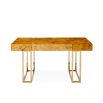 A classic burled mappa desk with a polished brass base