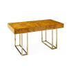 A classic burled mappa desk with a polished brass base