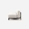 White, contemporary, armless, outdoor sofa with dark brown frame