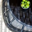 Rounded black weave coffee table with glass top