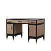 A luxurious mahogany and rattan executive desk with antique brass details