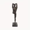 An elegant decorative statue which depicts a dance pose and bronze finish 