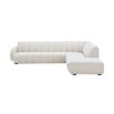 A sumptuous sectional sofa by Jonathan Adler upholstered in an Olympus Ivory bouclé with stylish deep channelled cushions and capsule-shaped arms