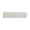 A sumptuous sectional sofa by Jonathan Adler upholstered in an Olympus Ivory bouclé with stylish deep channelled cushions and capsule-shaped arms