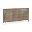 A sophisticated dresser by Caracole with contemporary curves and twelve spacious drawers