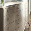 A sophisticated dresser by Caracole with contemporary curves and twelve spacious drawers