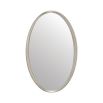 A luxury oval wall mirror by Caracole with a stunning silver leaf finish