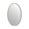 A luxury oval wall mirror by Caracole with a stunning silver leaf finish