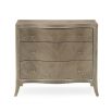 A charming and curvaceous bedside table by Caracole with an inlay pattern