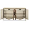 A luxurious champagne-coloured sideboard with interior shelving and drawers