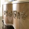 A luxurious champagne-coloured sideboard with interior shelving and drawers