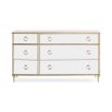 A luxurious mirrored dresser/chest of drawers with antique detailing and a champagne finish