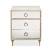 A luxury bedside table with a mirrored design, white marble top and glamorous gold detailing