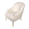 Faux sheepskin upholstered chair complemented by chic brass legs