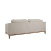 A luxurious modern cosy sofa with beige upholstery  