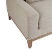 A luxurious modern cosy sofa with beige upholstery  