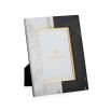 An elegant frame made of white and black marble with gold details