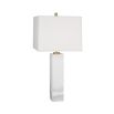 A glamorous solid marble table lamp with polished brass accents