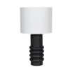 A stylish table lamp with a distinctive black, ceramic base and a crisp white linen shade