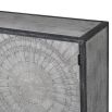 grey and black distressed sideboard with circular patterns