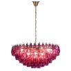Vibrant pink chandelier composed of intricate fragments of delicate glass