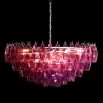 Vibrant pink chandelier composed of intricate fragments of delicate glass