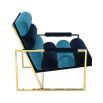 A glamorous two-toned blue velvet lounge chair 