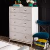 A glamorous Hollywood-inspired six drawer chest with acrylic and nickel details