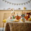 Wooden kids birthday decoration in the shape of a dog, with space for candle holders