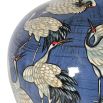 A gorgeous, ceramic vase with a stunning, bird-inspired illustration 