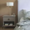 Grey finish bedside table with shelf and ring pull handled drawer
