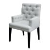 Contemporary, deep buttoned dining chair with arms and piping detail