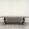 Large grey dining table with washed wood finish