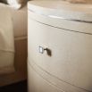 A luxurious chest of drawers with an undulating design, shagreen-embossed leather wrapping and nickel details  