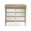 A glamorous bedside table with antique mirrored drawers and a champagne gold finish