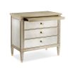 A glamorous bedside table with antique mirrored drawers and a champagne gold finish