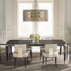 A luxury extendable dining table by Caracole with glamorous gold details