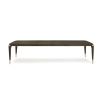 A luxury extendable dining table by Caracole with glamorous gold details