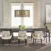 A luxury extendable dining table by Caracole with glamorous gold details