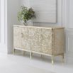 A beautiful sideboard by Caracole with fabulous floral embellishments and gold finished detailing