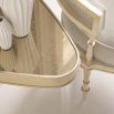 Glamorous gently triangular side table with acrylic legs and champagne gold finish